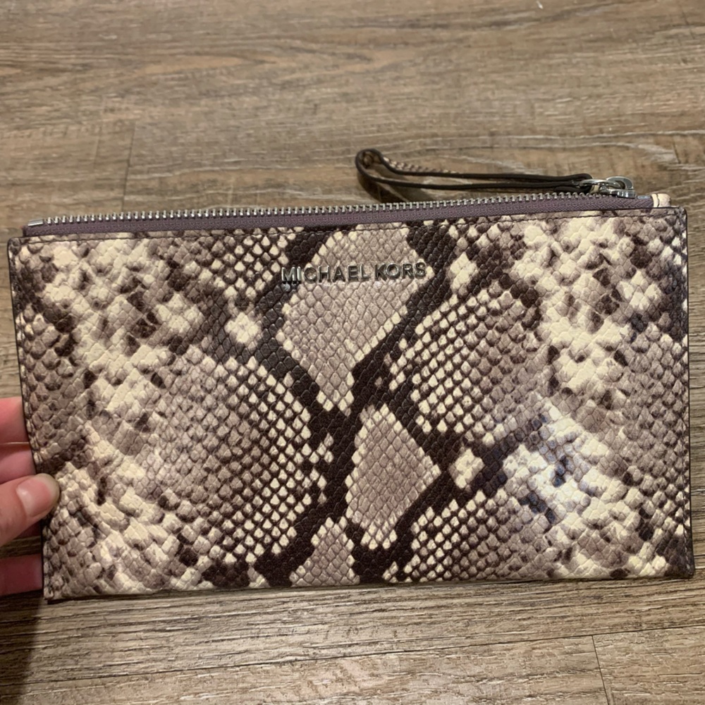 Michael Kors Snakeskin print wristlet.